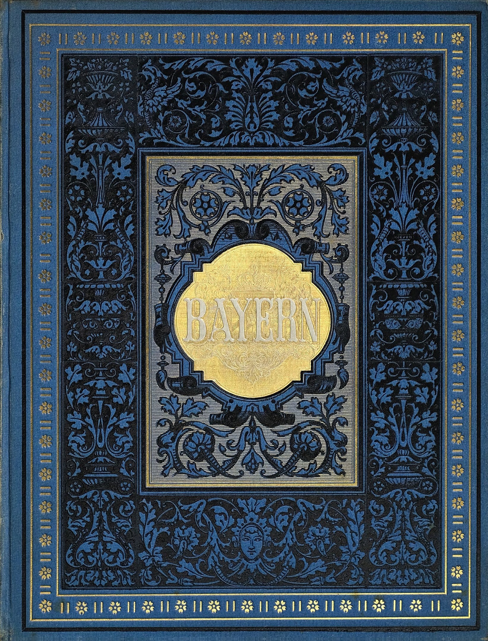 Ein blau-goldenes Buch mit dem Wort "Bayern" auf seinem kunstvoll gestalteten Cover.
