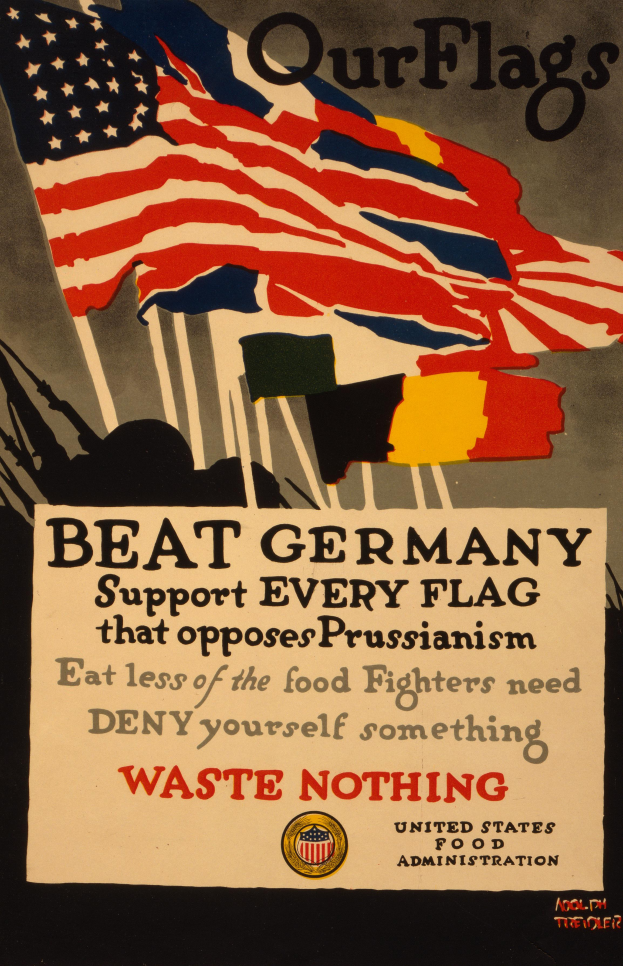 Ein Plakat mit einer roten, weißen und blauen Flagge mit einem weißen Stern, begleitet von fettgedrucktem schwarzem Text, der "Unsere Flaggen schlagen Deutschland - Unterstützt jede Flagge, die gegen Preußentum kämpft", mit einem weißen Rand um den Text.
