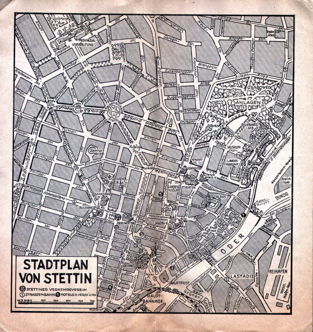 Ein detailliertes altes Stadtplan von Stuttgart auf Papier, das Straßen, Gebäude und Sehenswürdigkeiten zeigt, mit zusätzlichem Text.
